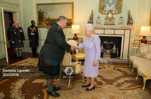 Queen Elizabeth II meets Honorary Colonel Geordie Elms of the 48th Highlanders of Canada during a private audience at Buckingham Palace, London, in her capacity as