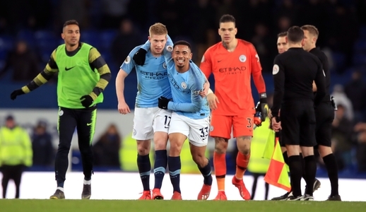 Manchester City's Gabriel Jesus (centre) and Kevin De Bruyne embrace after the Premier League match at Goodison Park, Liverpool.