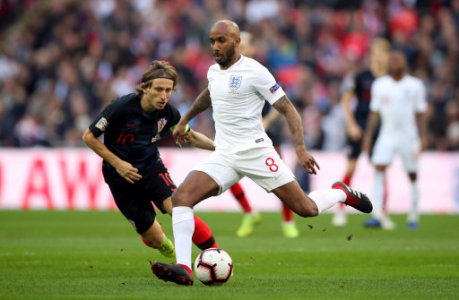 England's Fabian Delph is put under pressure by Croatia's Luka Modric