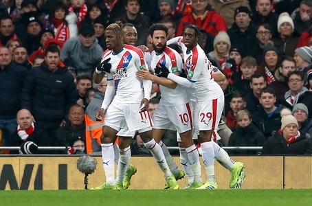 Crystal Palace's Andros Townsend (left) celebrates scoring his side's first goal of the game with team-mate Wilfried Zaha during the Premier League match at Anfield, Liverpool.