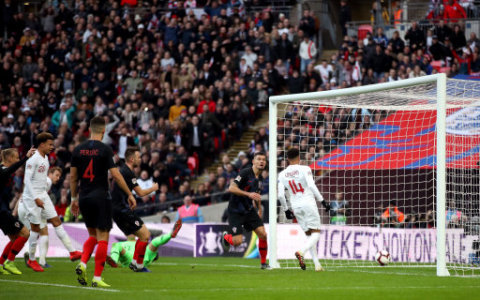 England's Jesse Lingard scores his side's first goal of the game